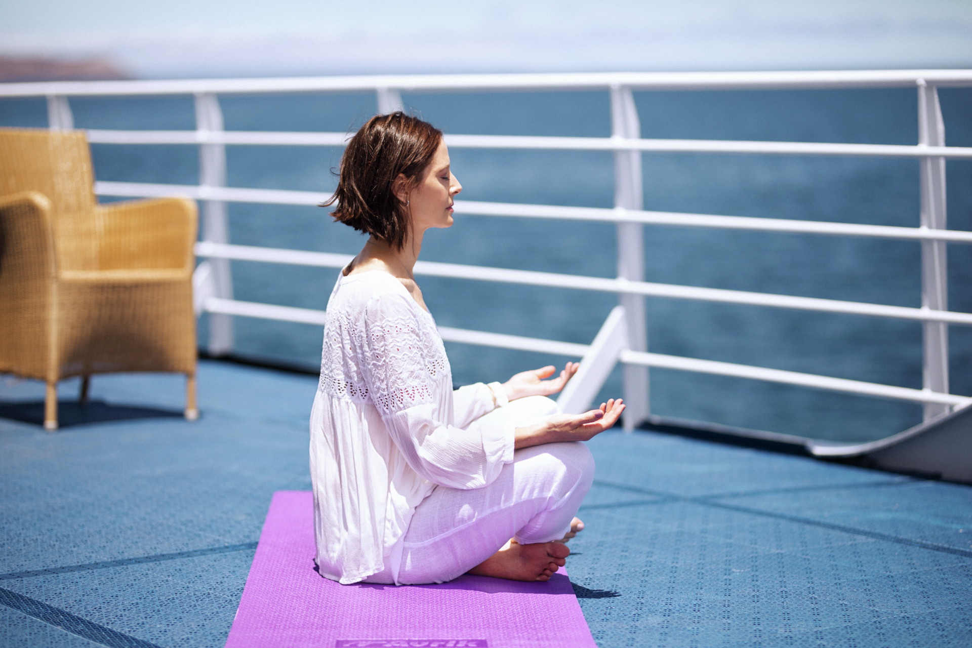 The fitness center is equipped with yoga mats, set of weights, treadmills, and two stationary bikes