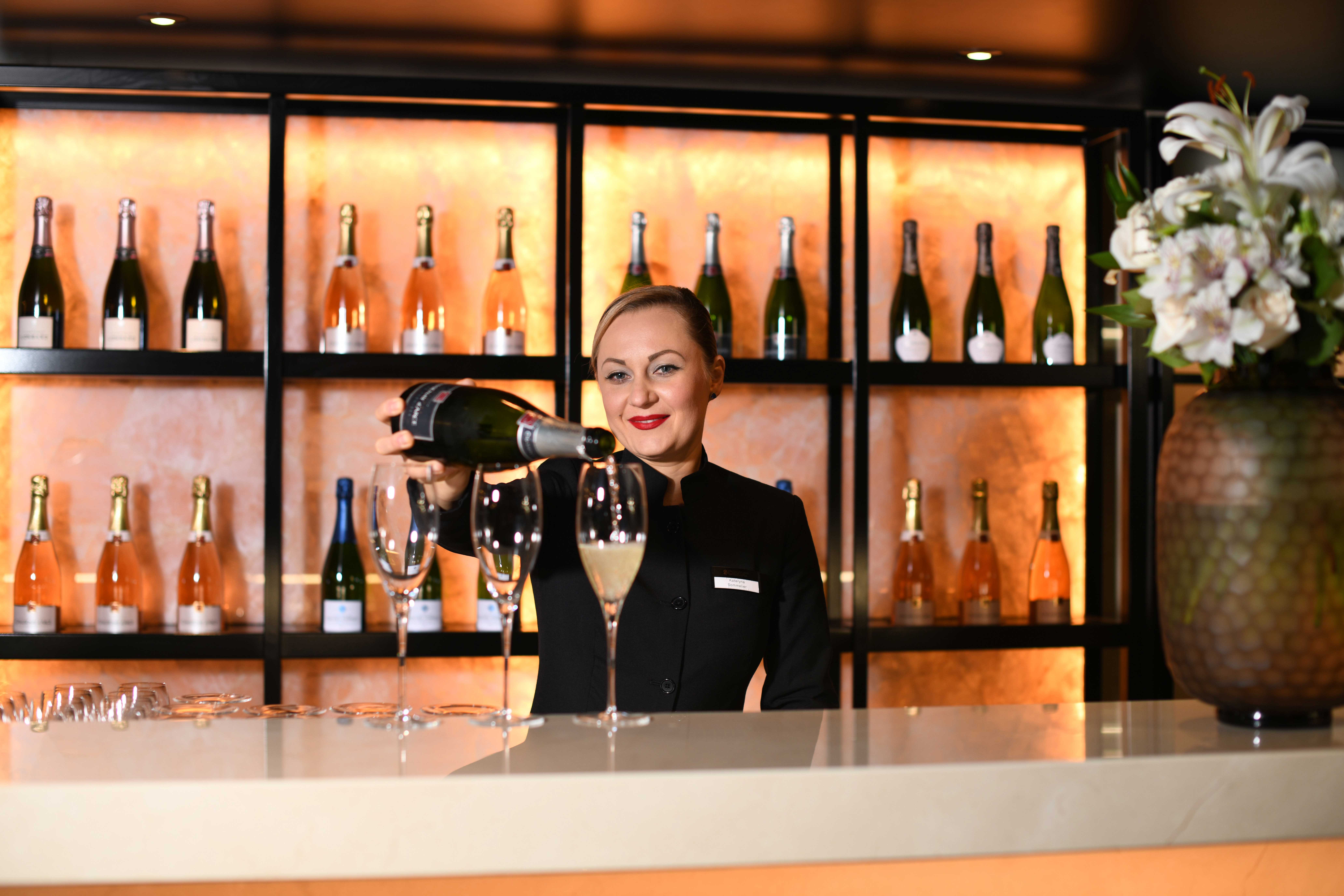 Treat yourself with a glass of champagne at the bar