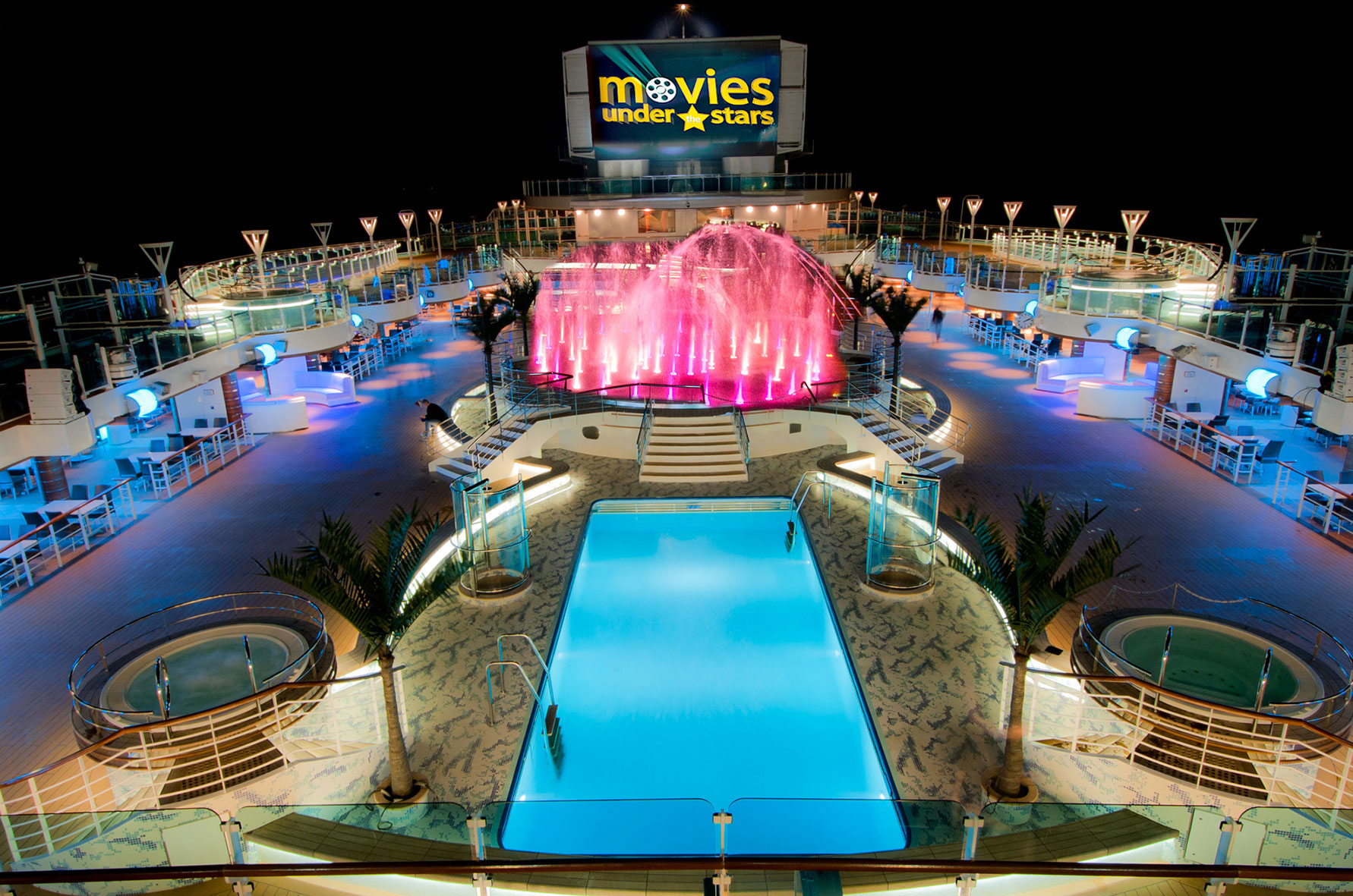 Watch a film under the stars on the pool deck