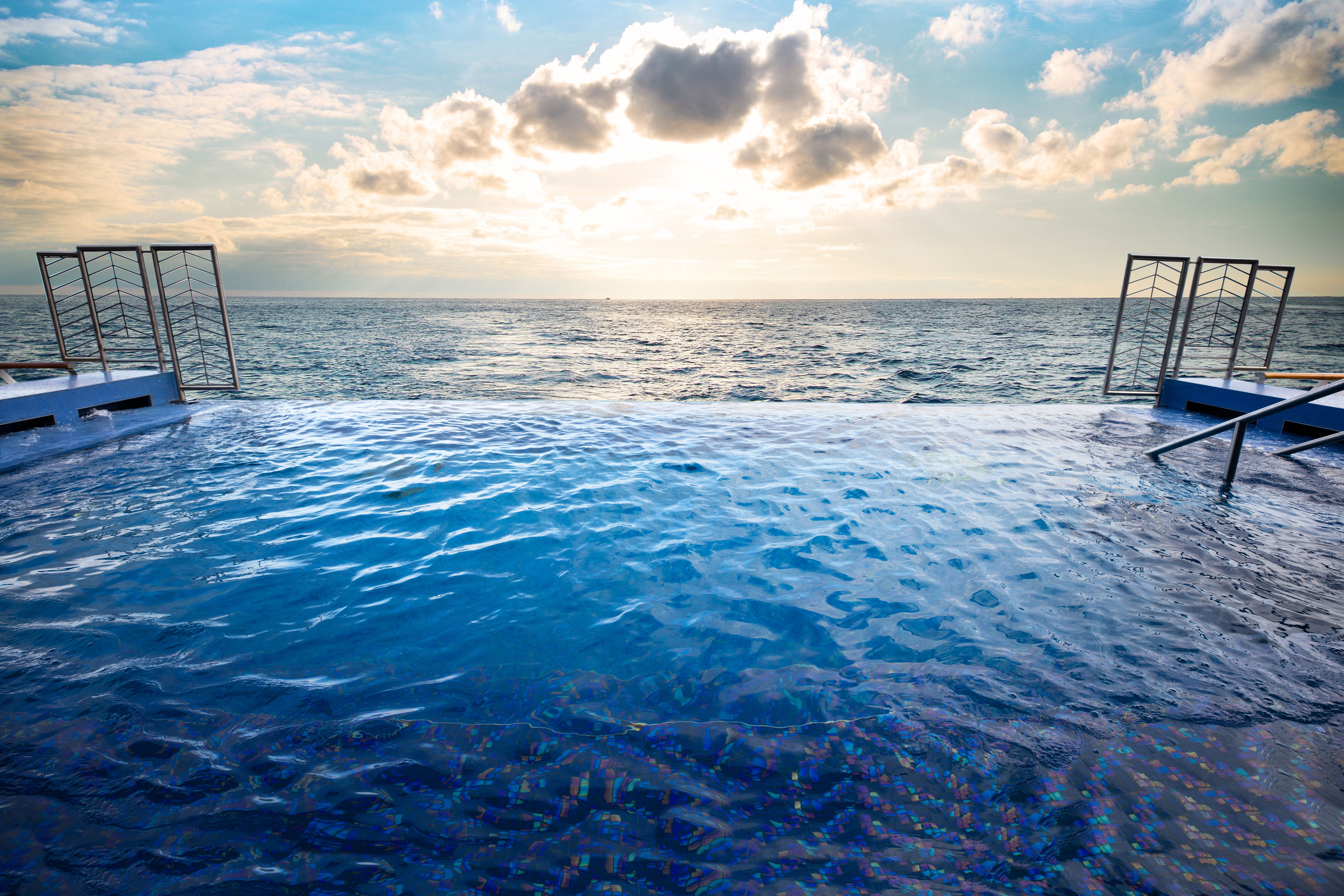 Step into the infinity pool adjacent to the Spa
