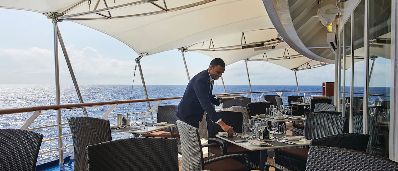Outdoor dining with sea views.