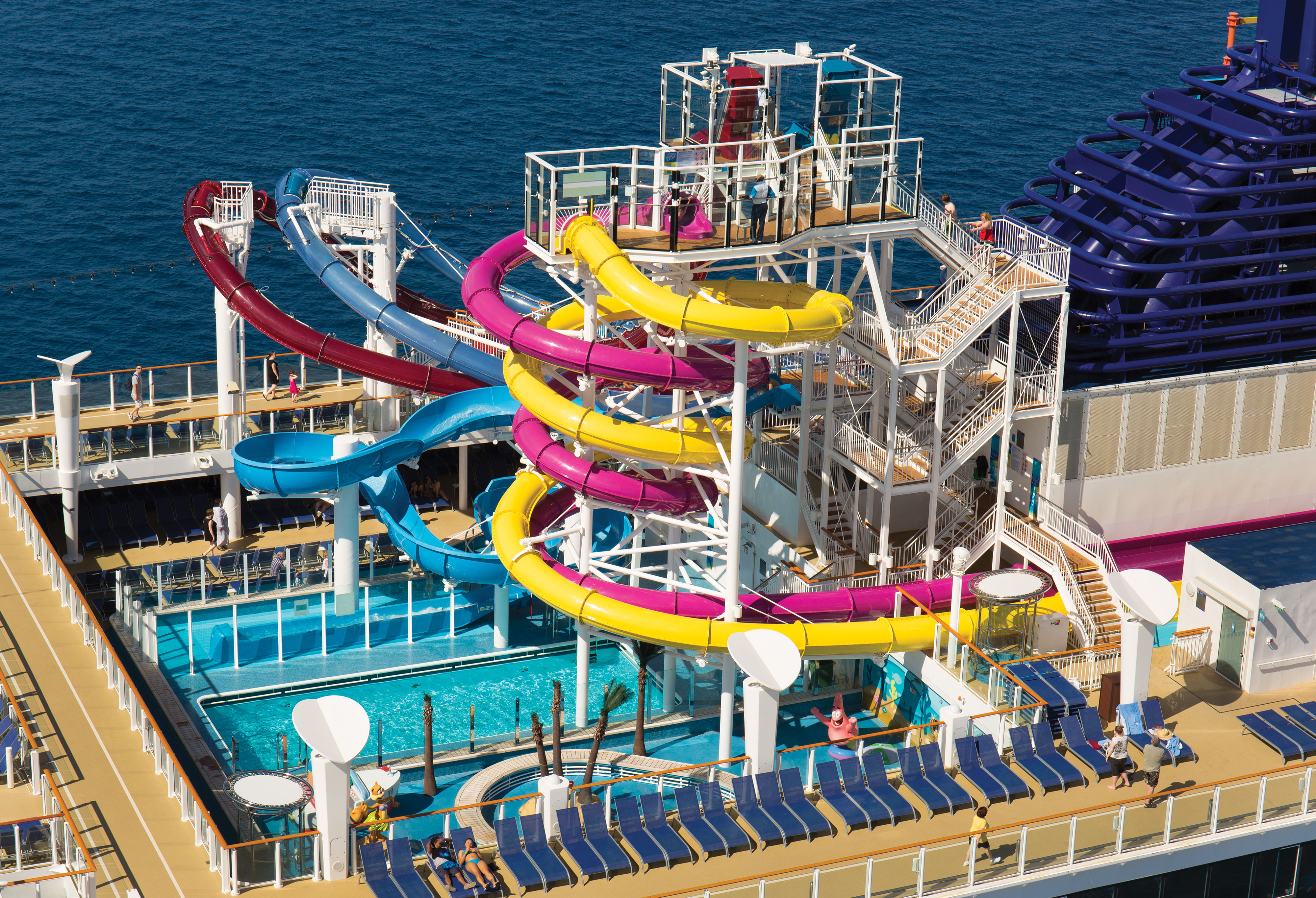 3 water slides over the pool deck