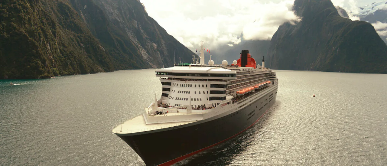 Cunard QM2 cruising in Milford Sound