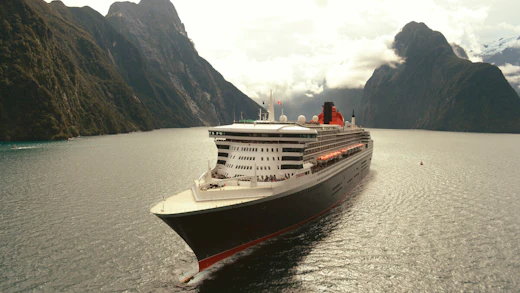 Cunard QM2 cruising in Milford Sound