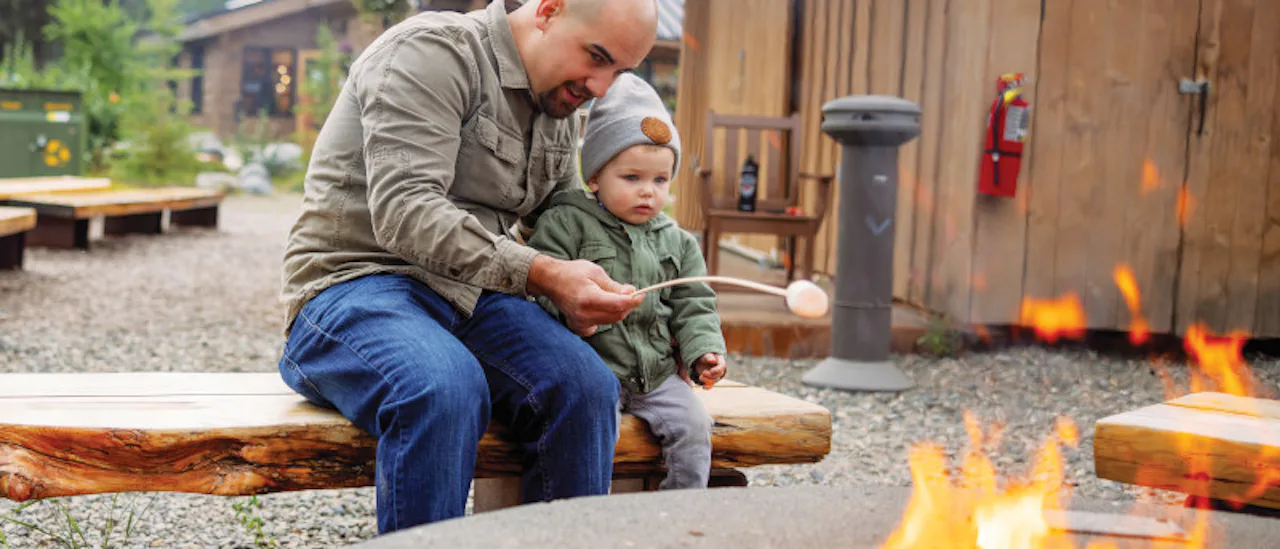 Father and son toasting smores Denali