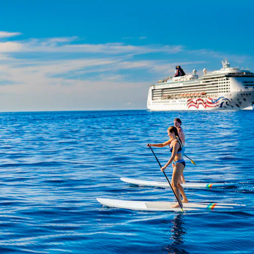 Hawaii couple paddleboarding by Pride of America