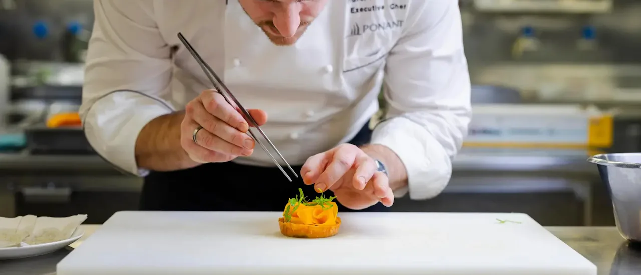 Chef putting final touches on dish