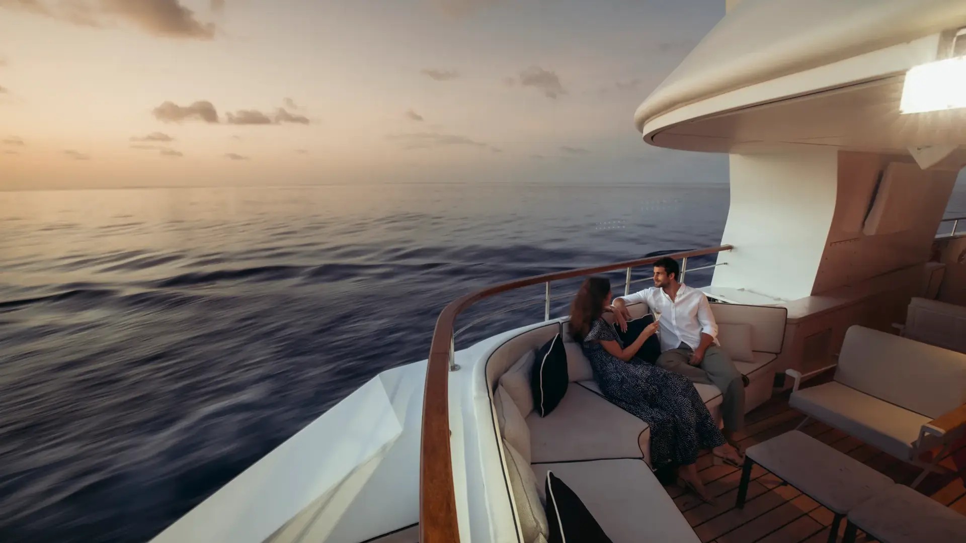 Couple relaxing onboard