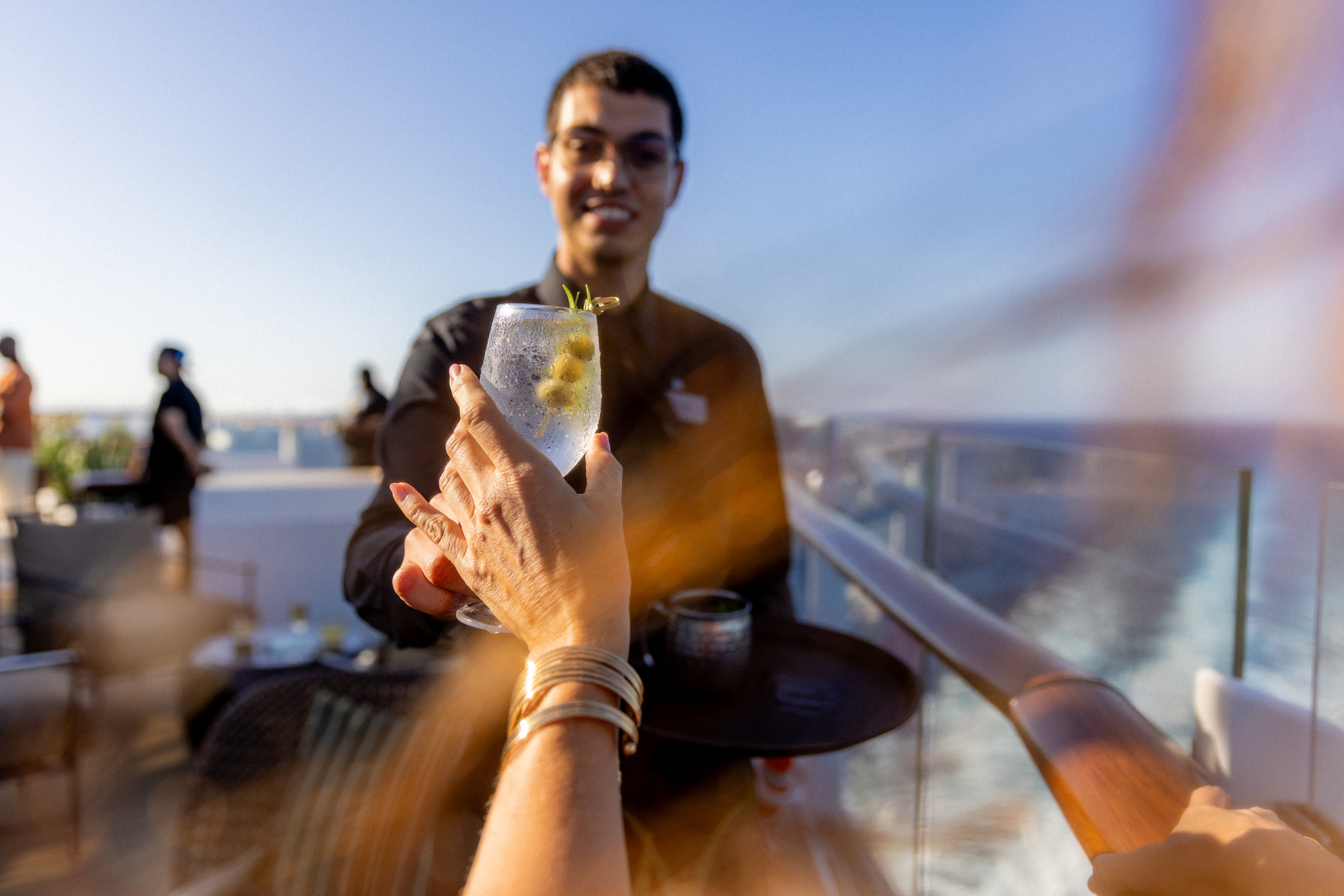 Crew serving drink