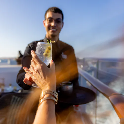 Crew serving drink