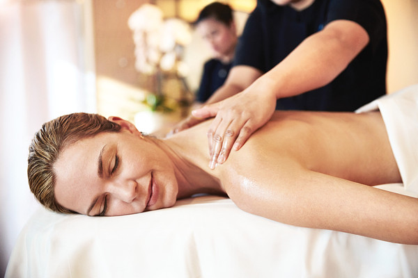 Woman enjoying massage at Lotus Spa