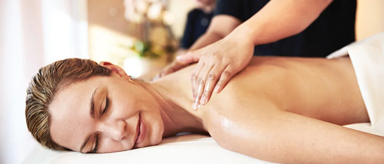 Woman enjoying massage at Lotus Spa